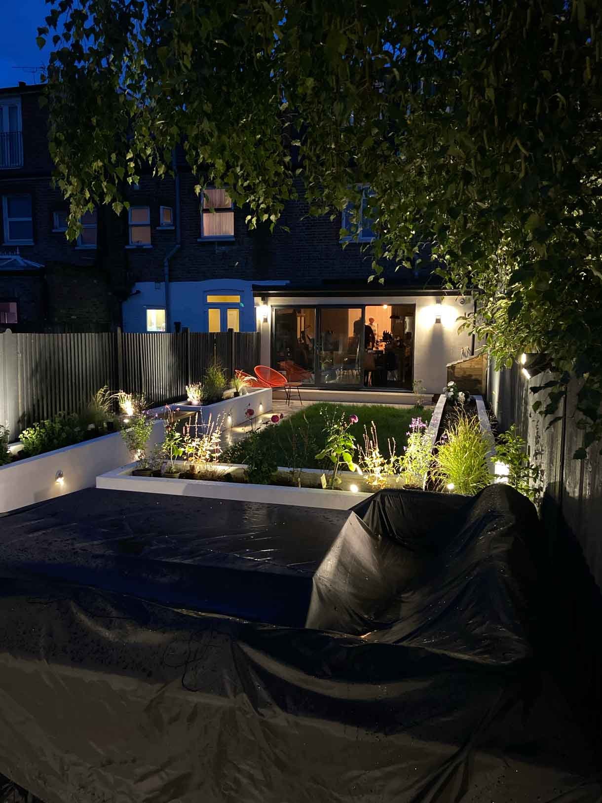 This Tooting garden, previously neglected for decades as a rental property, was transformed into a vibrant and functional outdoor space tailored to the new owners' vision. With a sunny aspect throughout the day, the garden had long been underutilized, but we set out to change that by creating a design that aligned perfectly with the clients' lifestyle and love for outdoor entertaining. We introduced distinct seating areas, raised planters to add structure and greenery, and installed lighting to ensure the garden could be enjoyed from morning until late evening, delivering a welcoming atmosphere that invites relaxation and social gatherings.