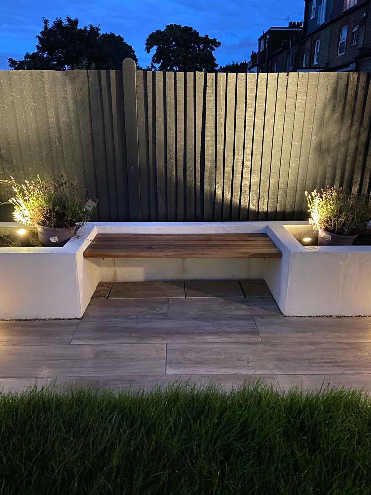 This Tooting garden, previously neglected for decades as a rental property, was transformed into a vibrant and functional outdoor space tailored to the new owners' vision. With a sunny aspect throughout the day, the garden had long been underutilized, but we set out to change that by creating a design that aligned perfectly with the clients' lifestyle and love for outdoor entertaining. We introduced distinct seating areas, raised planters to add structure and greenery, and installed lighting to ensure the garden could be enjoyed from morning until late evening, delivering a welcoming atmosphere that invites relaxation and social gatherings.
