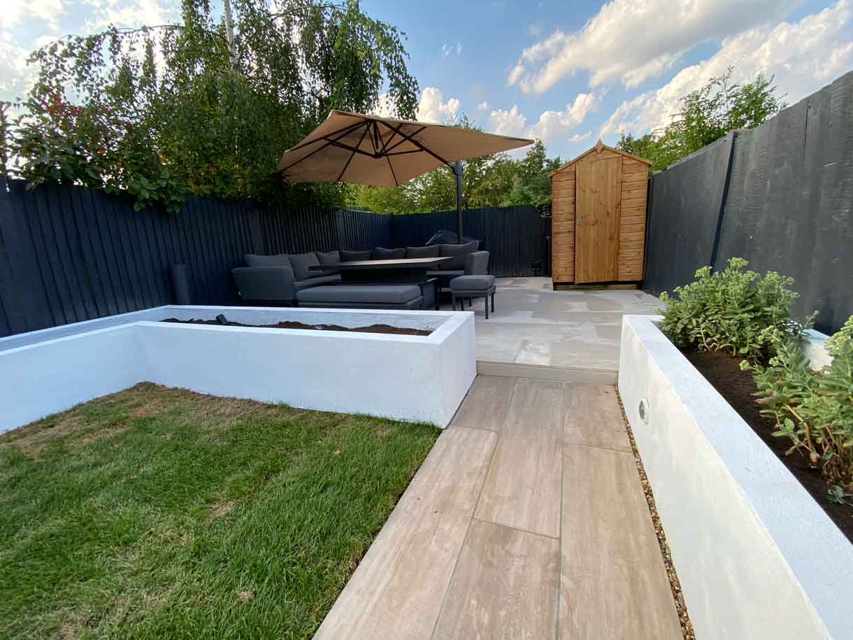 This Tooting garden, previously neglected for decades as a rental property, was transformed into a vibrant and functional outdoor space tailored to the new owners' vision. With a sunny aspect throughout the day, the garden had long been underutilized, but we set out to change that by creating a design that aligned perfectly with the clients' lifestyle and love for outdoor entertaining. We introduced distinct seating areas, raised planters to add structure and greenery, and installed lighting to ensure the garden could be enjoyed from morning until late evening, delivering a welcoming atmosphere that invites relaxation and social gatherings.
