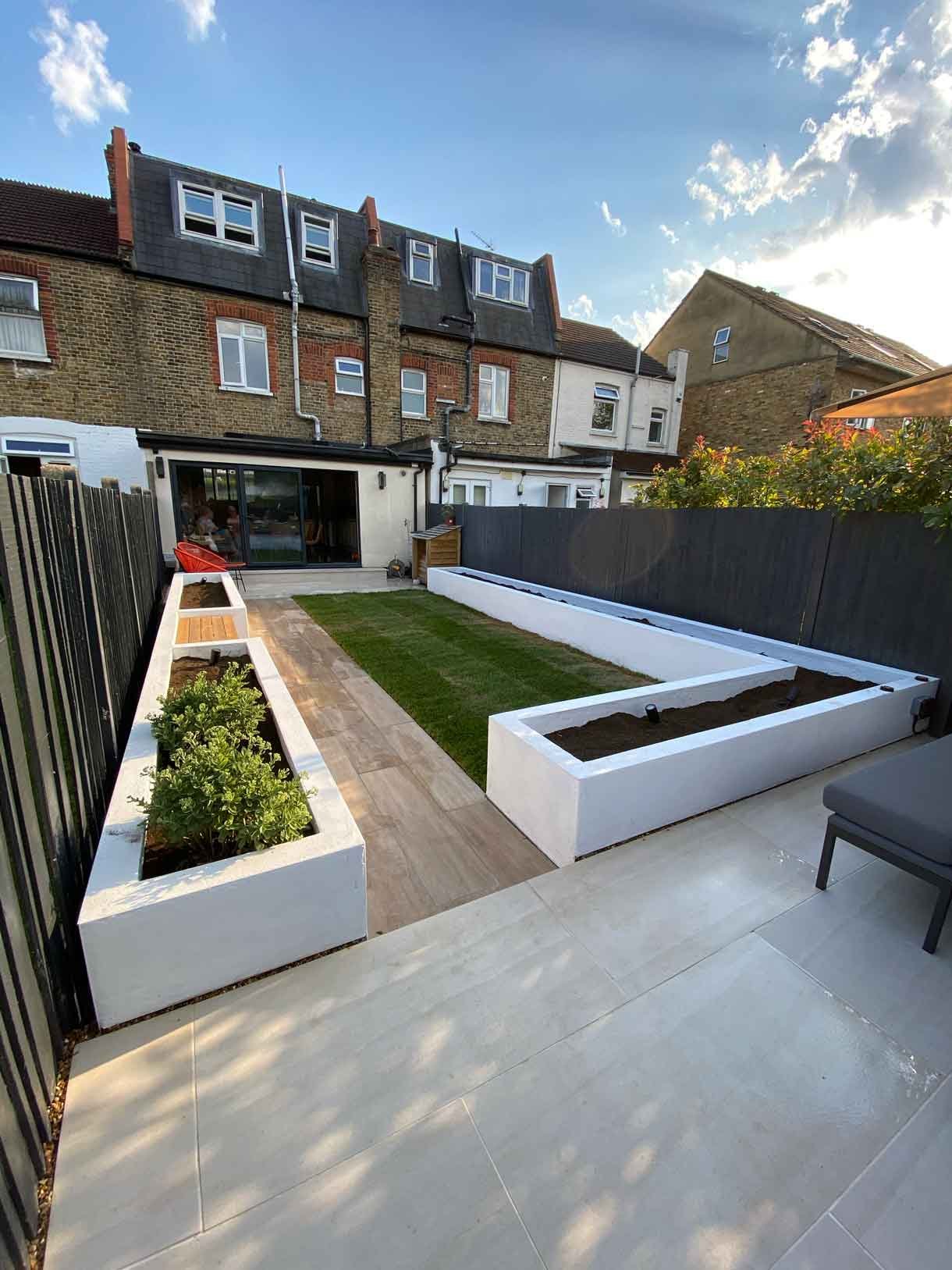 This Tooting garden, previously neglected for decades as a rental property, was transformed into a vibrant and functional outdoor space tailored to the new owners' vision. With a sunny aspect throughout the day, the garden had long been underutilized, but we set out to change that by creating a design that aligned perfectly with the clients' lifestyle and love for outdoor entertaining. We introduced distinct seating areas, raised planters to add structure and greenery, and installed lighting to ensure the garden could be enjoyed from morning until late evening, delivering a welcoming atmosphere that invites relaxation and social gatherings.