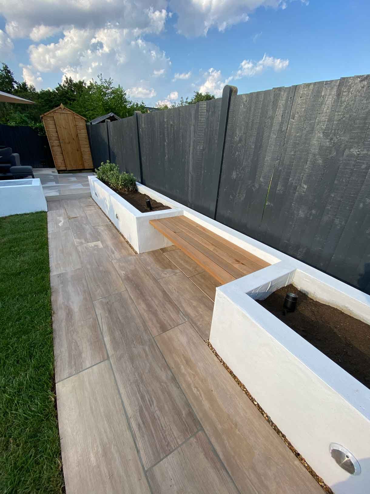 This Tooting garden, previously neglected for decades as a rental property, was transformed into a vibrant and functional outdoor space tailored to the new owners' vision. With a sunny aspect throughout the day, the garden had long been underutilized, but we set out to change that by creating a design that aligned perfectly with the clients' lifestyle and love for outdoor entertaining. We introduced distinct seating areas, raised planters to add structure and greenery, and installed lighting to ensure the garden could be enjoyed from morning until late evening, delivering a welcoming atmosphere that invites relaxation and social gatherings.